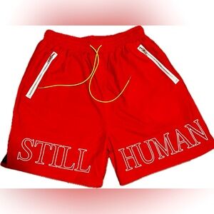 Red STILL HUMAN shorts
